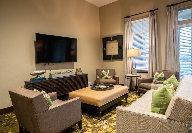 Spacious Walk-In Closet With Vanity Mirror Assisted Living Facility lounge-area-for-seniors
