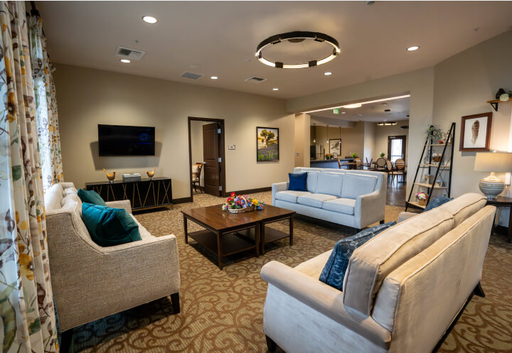 Modern Kitchen With Dark Cabinets Granite Countertops Assisted Living Facility shared-spaces-assisted-living