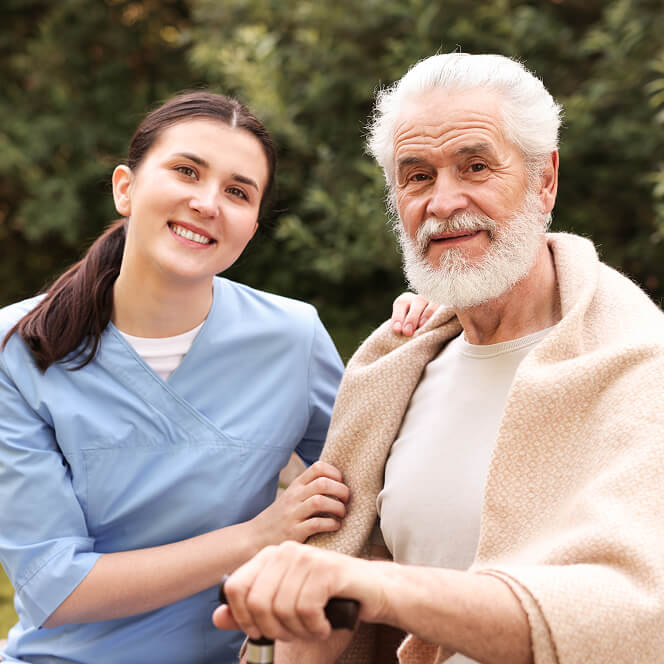 Caregiver Comforting Resident at Assisted Living Facility